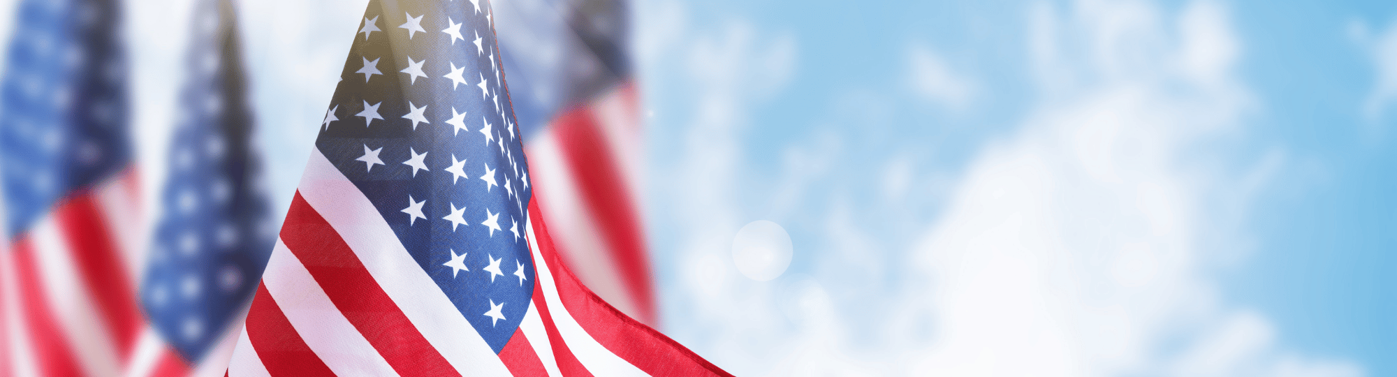 American Flags against blue sky