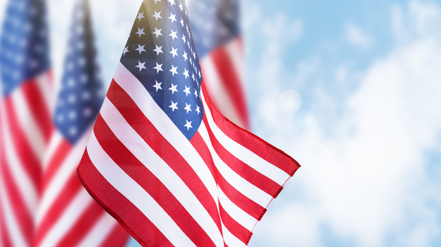 American Flags against blue sky