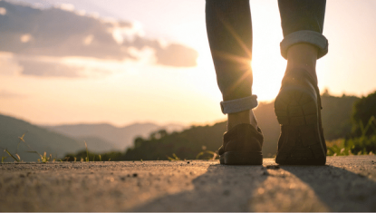 Feet walking on road